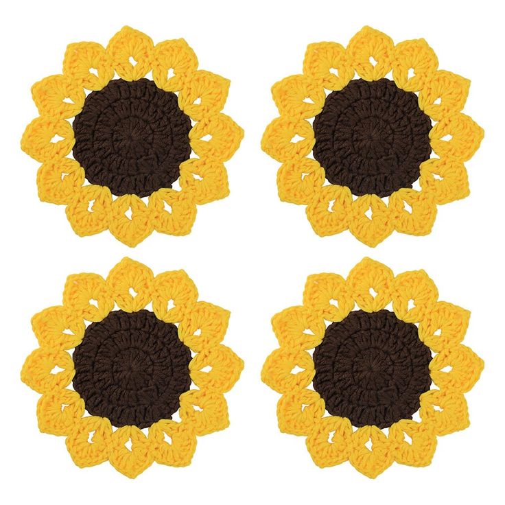 four crocheted sunflowers are shown in yellow and brown