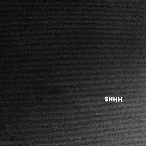 a black and white photo with the word shh on it's back side