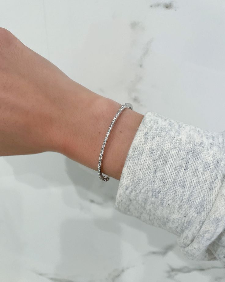 This classic, streamlined bangle is a no-brainer addition to your jewelry collection. Beautiful stacked or solo, it's bound to become your new signature. Ring Concierge, Necklace Length Guide, Bracelet Size Chart, Custom Engagement Rings, Hinged Bracelet, Diamond Bangle, Bezel Diamond, Engagement Ring Wedding Band, Jewelry For Women