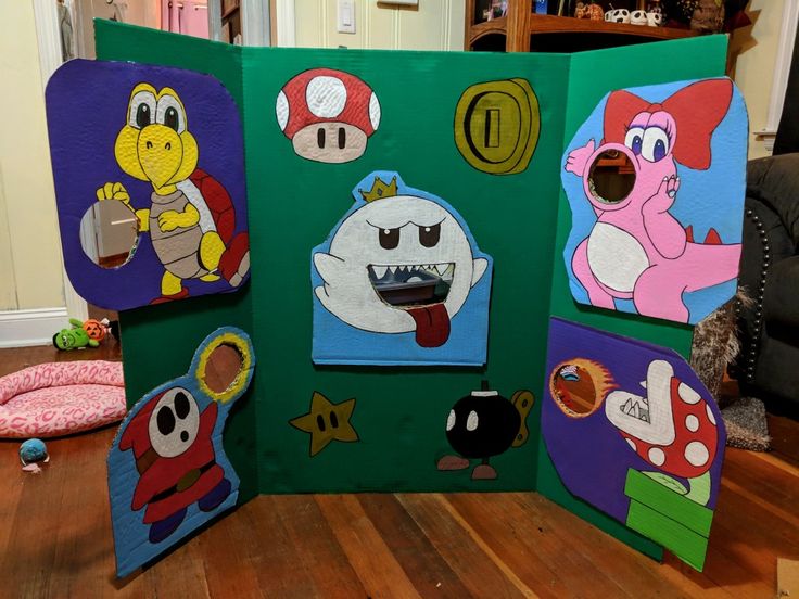 an art project made out of cardboard with mario and luigi characters on it's sides