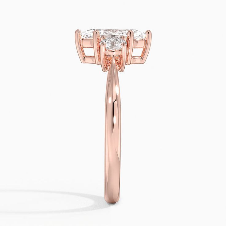 Lab Grown Selene Three Stone Diamond Engagement Ring (1/3 ct. tw.) - 14K Rose Gold. Classic simplicity defines this setting, which features a precious metal band that gently tapers towards a diamond accent on each side of the center gem (1/3 total carat weight). Three Stone Diamond Rings Engagement, Three Stone Diamond Ring, Three Stone Diamond, Brilliant Earth, Metal Band, Precious Metal, Marquise Cut, Three Stone, Diamond Engagement Ring