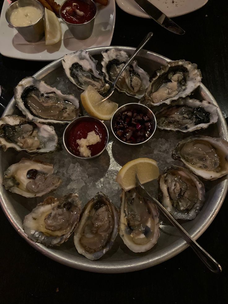 oysters on the half shell with dipping sauce