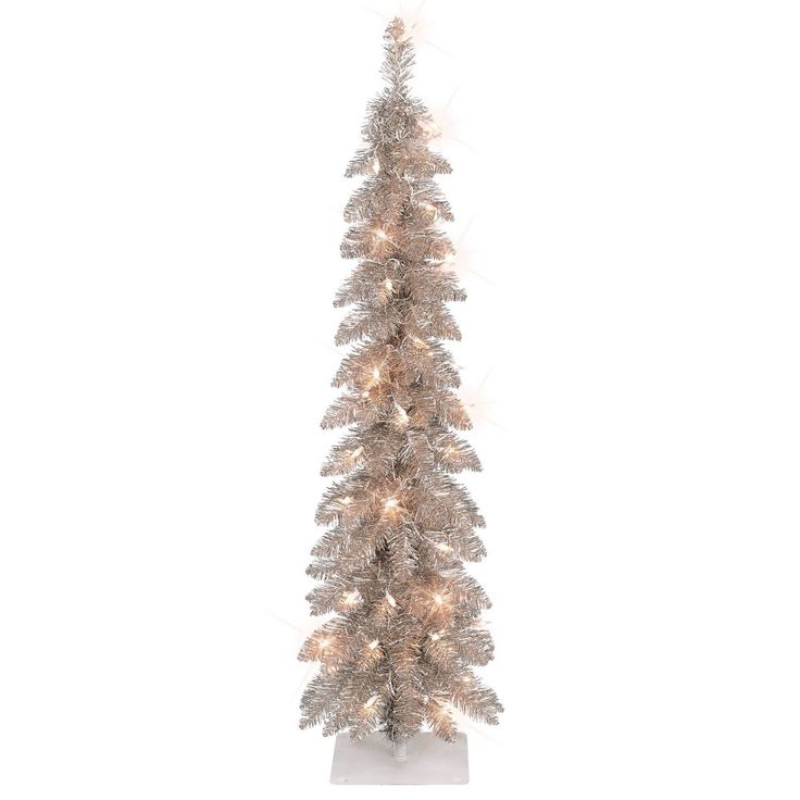 a white christmas tree with lights on it