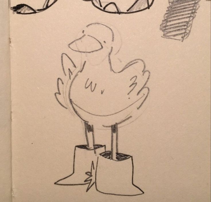 a drawing of a chicken sitting on top of a piece of paper next to a pair of glasses