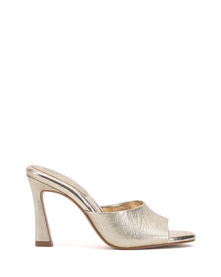 Vince Camuto-Paigely Mule - A minimalist mule gets an update with a flared heel, adding a modern architectural touch to the Paigely. Designed with an open round toe, the shoe features a stitched pillow footbed for all-day wearability and comfort. Wear it with cropped trousers and a blazer for a corner-office-to-cocktails look. Size GuideShoe Measurement Guide Fitted Evening Mules With Branded Heel Counter, Modern Fitted Sandals With Block Heel, Modern Sandals With Block Heel, Modern Block Heel Sandals, Modern Fitted Mules With Deep Heel Cup, Sleek Open Toe Mules For Spring, Modern Fitted Mules With Sculpted Heel, Modern Pointed Toe Cocktail Sandals, Sleek Open Heel Mules For Spring