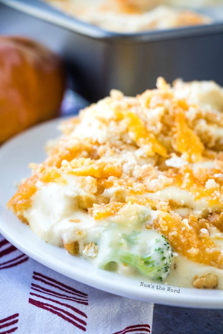 a close up of a plate of food with broccoli and cheese on it