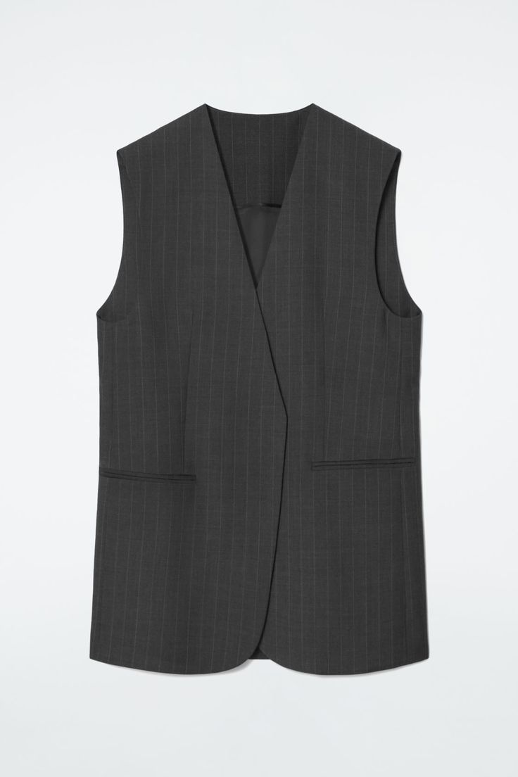 Classic tailoring meets modern design codes in this charcoal vest. Made from RWS wool, it's woven with subtle pinstripes and cut in an elongated, wrap-front shape. Style it as a suit with the matching pants. Regular fitFront welt pocketsThis product contains Responsible Wool Standard TE-00047206 (RWS) wool fiber from farms certified to animal welfare and land-management requirements  Shell: 100% RWS Wool. Lining: 100% Viscose. Excluding trims / Dry clean Back length of size 6 is 30.43" / Model wears a size 6 Tailored Waistcoat, Timeless Knitwear, Wool Waistcoat, Classic Tailoring, Striped Knitted Sweater, Land Management, High Waisted Briefs, Ankle Length Jeans, Women Magazines