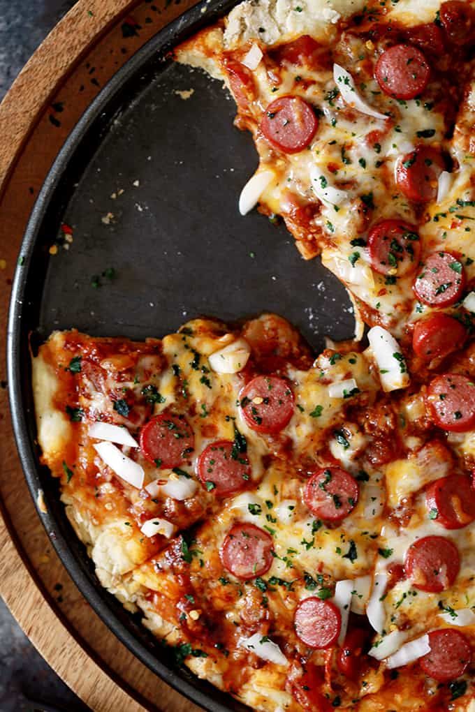 two slices of pepperoni pizza on a pan