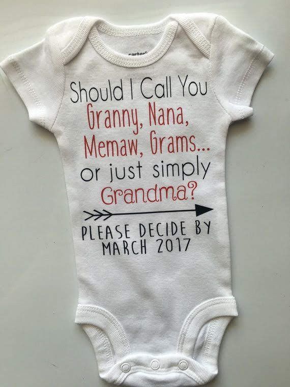 a white baby bodysuit with an arrow on it that says should i call you granny nana, mema, grams or just simply grandma? please decide by march 2011