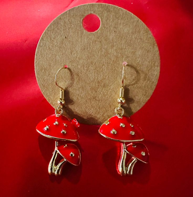 gold  tone, mushroom  Fish hook, alloy metal; nickel-free Adjustable Novelty Single Earring Jewelry, Novelty Gold Metal Jewelry, Metal Mushroom Design Jewelry As Gift, Mushroom Design Drop Earrings, Nickel-free Mushroom-shaped Earrings For Gifts, Nickel-free Mushroom Shaped Earrings As Gift, Adjustable Mushroom Design Drop Earrings, Novelty Gold Earrings, Gold Novelty Dangle Jewelry