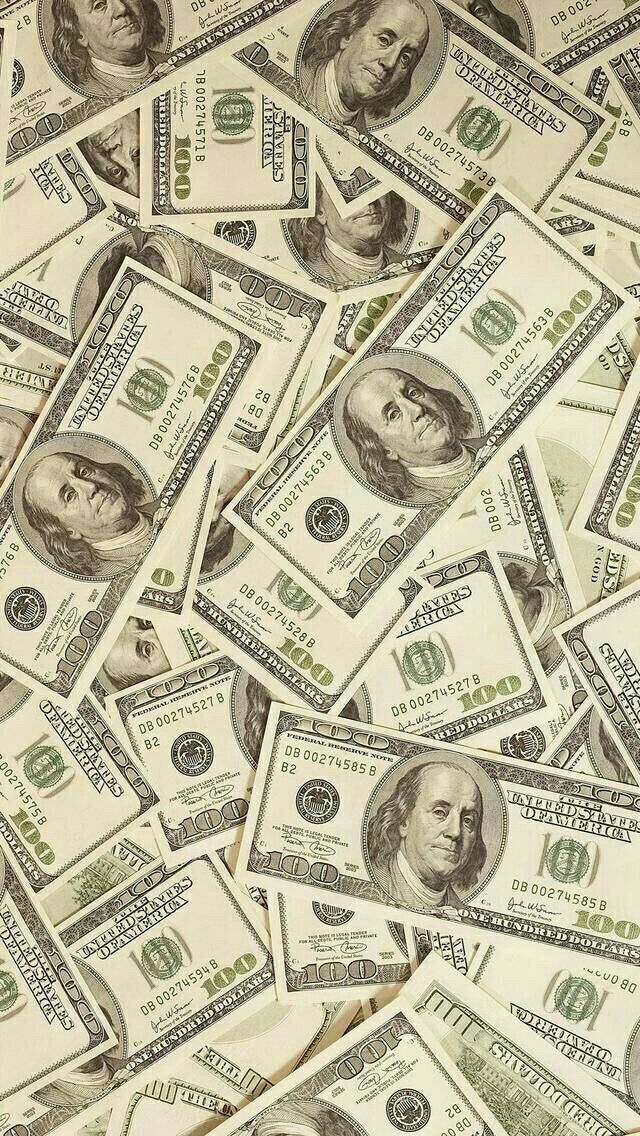 a pile of twenty dollar bills sitting on top of each other