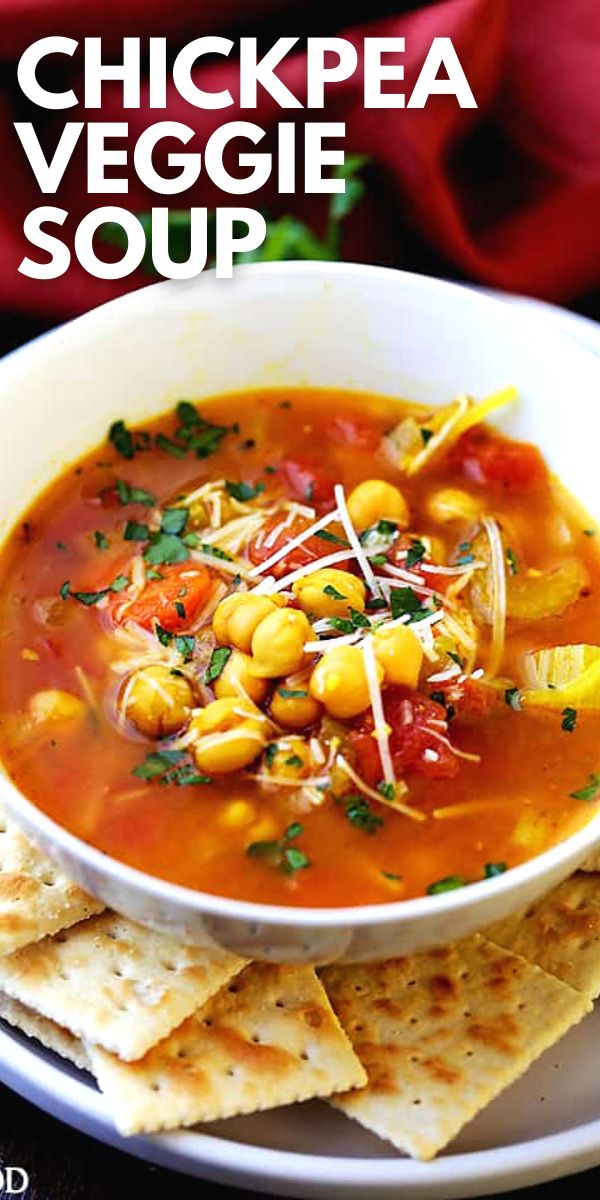 a bowl of chickpea veggie soup with tortilla chips