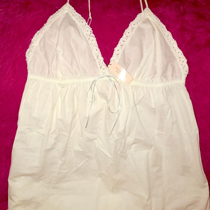 Cotton White With Embroidered Trim Of White Lace With Baby Blue Ribbon And Straps White Cotton V-neck Sleepwear, Spring White Cotton Sleepwear, White Cotton Sleepwear For Spring, White Cotton Sleepwear For Summer, Summer Cream Sleepwear With Lace Trim, Cream Lace Trim Summer Sleepwear, Cream Lace Trim Sleepwear For Summer, Cotton Camisole Sleepwear For Vacation, White Lace Trim Sleepwear For Spring