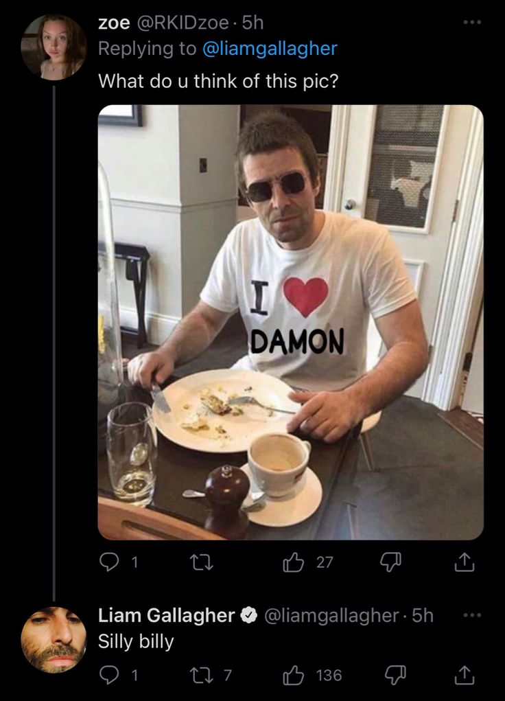 a man sitting at a table with food in front of him