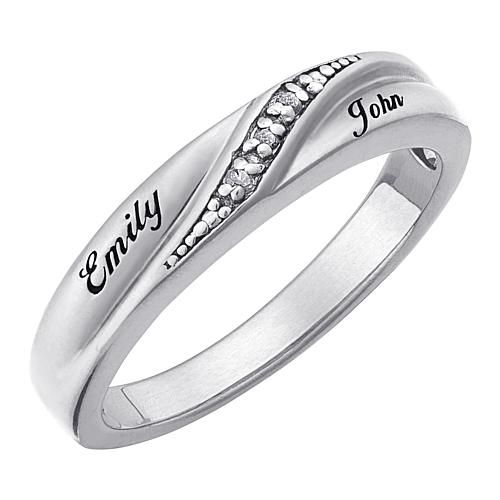 When she says "I do," give her a ring to cherish forever. This polished, Sterling silver or 18K Gold Over Sterling wedding band features elegant genuine Diamond accents that will sparkle and shine for years to come. You can make this ring even more special by personalizing the piece with your names, up to 10 letters per name. When she sees how much thought you put into this elegant wedding band, she'll fall in love with you all over again.  Sterling, Personalize with 2 names of up to 10 characte Personalized White Gold Diamond Ring With Cubic Zirconia, Personalized Classic Cubic Zirconia Diamond Ring, Classic Personalized Cubic Zirconia Diamond Ring, Promise Jewelry Channel Set Cubic Zirconia, Promise Jewelry With Cubic Zirconia Channel Set, Promise Jewelry With Channel Set Cubic Zirconia, Promise Ring With Diamond Cut In Sterling Silver, Elegant Promise Ring With Channel Set, Fine Jewelry Promise Ring With Diamond Accents