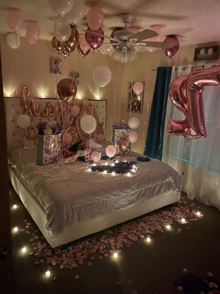 a bedroom decorated with balloons, streamers and confetti