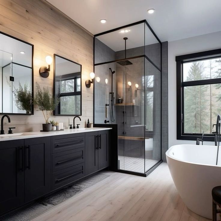 a bathroom with a large tub and two sinks