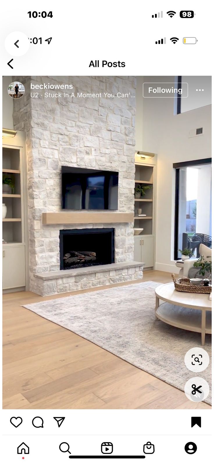 the living room is clean and ready to be used for tvs, fireplaces, and bookshelves