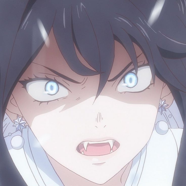 a close up of a person with blue eyes and an evil look on their face