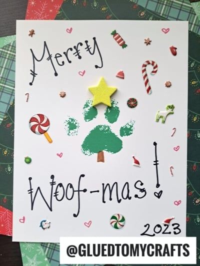 a handmade christmas card with the words merry woof - mas and a tree