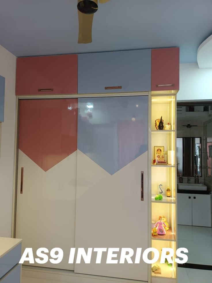 the interior of an apartment with pink, blue and white walls