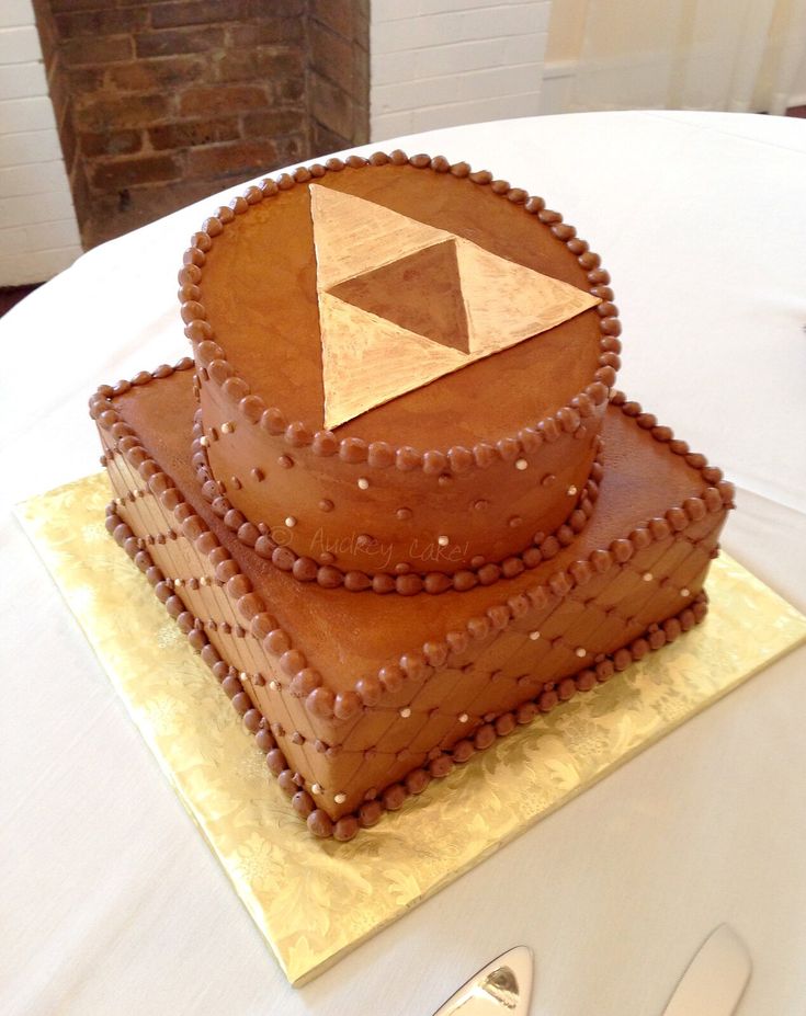 a brown cake sitting on top of a white table