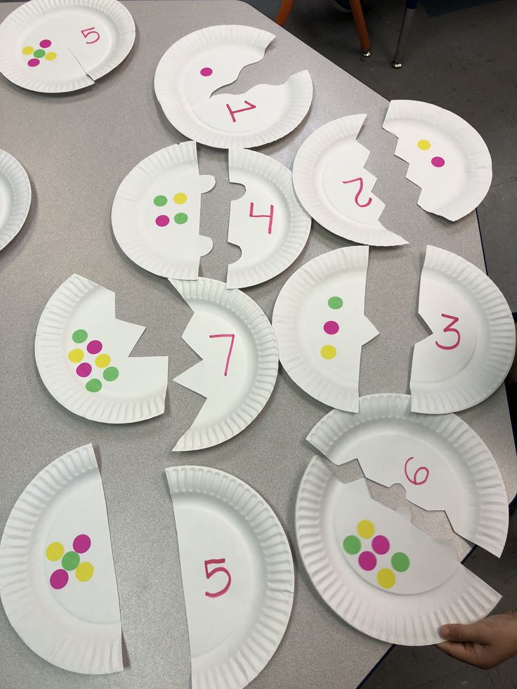 paper plates with numbers and shapes on them