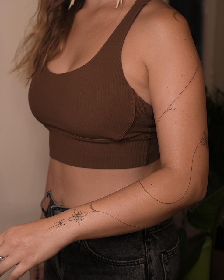 a woman with a tattoo on her arm