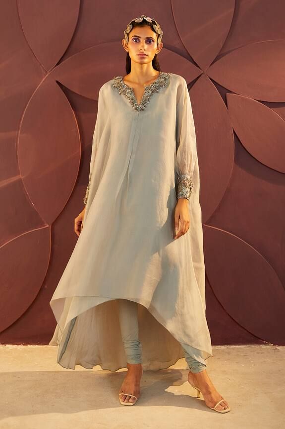 Powder blue organza embroidered neckline kaftan style kurta with dabka and thread work detailing. Paired with lycra churidar and inner.
Component: 3
Pattern: Embroidery
Type Of Work: Dabka, Thread Work
Neckline: Round Notched
Sleeve Type: Embroidered Cuffs
Fabric: Silk Organza, Lycra, Net
Color: Blue
Other Details: 
Floral embroidery on neckline and cuff
Asymmetric hem
Note: Kindly contact customer care for color customization
Occasion: Mehendi and Haldi - Aza Fashions Kaftan Set, Blue Kaftan, Asymmetric Kurta, Embroidered Cuffs, Blue Organza, Kaftan Style, Designer Party Wear Dresses, Dream Wedding Ideas Dresses, Pattern Embroidery