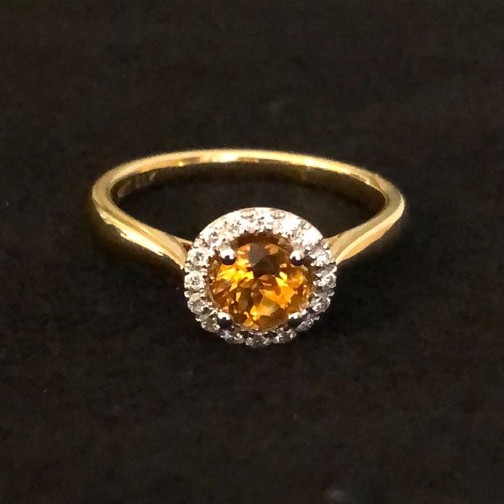 14k Gold Ring Features Round Orange Citrine And Diamond Halo. Comes With Black Velvet Ring Holder. Yellow Gold Topaz Ring With Yellow Sapphire Center Stone, Formal Citrine Rings With Brilliant Cut, Formal Citrine Diamond Ring With Center Stone, Luxury Orange Jewelry With Yellow Sapphire, Luxury Orange Yellow Sapphire Jewelry, Formal Orange Diamond Ring, 14k Gold Yellow Sapphire Ring, Yellow Gold Ring With Yellow Sapphire Center Stone, Yellow Gold Yellow Sapphire Ring With Center Stone