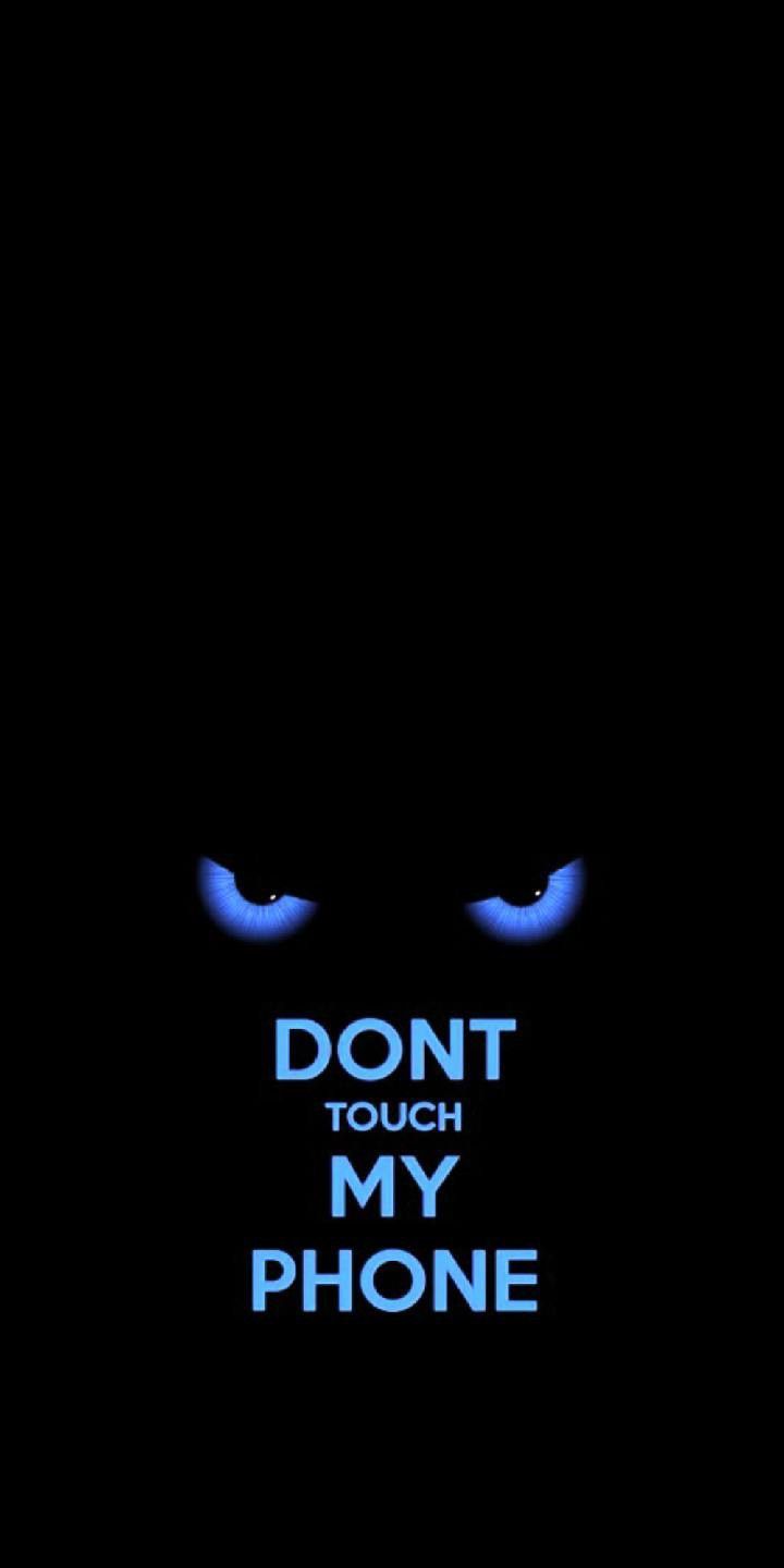 the words don't touch my phone are lit up in blue on a black background