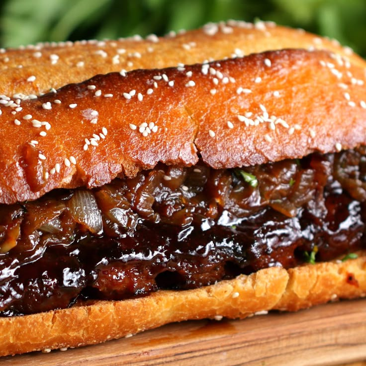 a close up of a sandwich on a wooden board