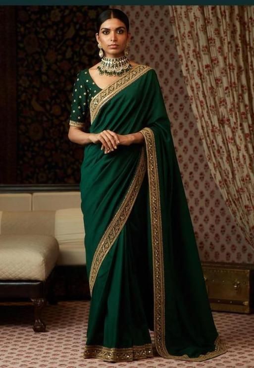 This saree featured in emerald green color silk. The border of the saree is handcrafted in zardozi work. The blouse is in emerald green color with zardozi embroidery on it. This saree can be customized in any color of your choice. Sabyasachi Sarees Organza, Marodi Work, भारतीय दुल्हन संबंधी, Latest Saree Blouse, Green Sari, Sabyasachi Sarees, Gota Patti Saree, Modern Saree, Look Plus Size