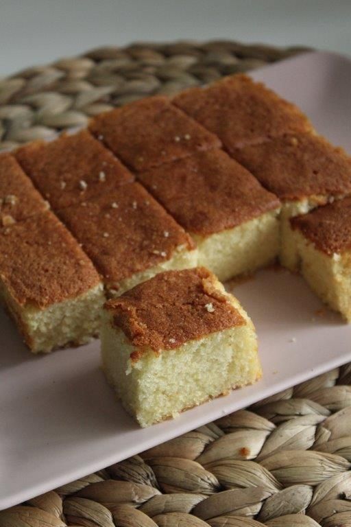 two pieces of cake sitting on top of a white plate