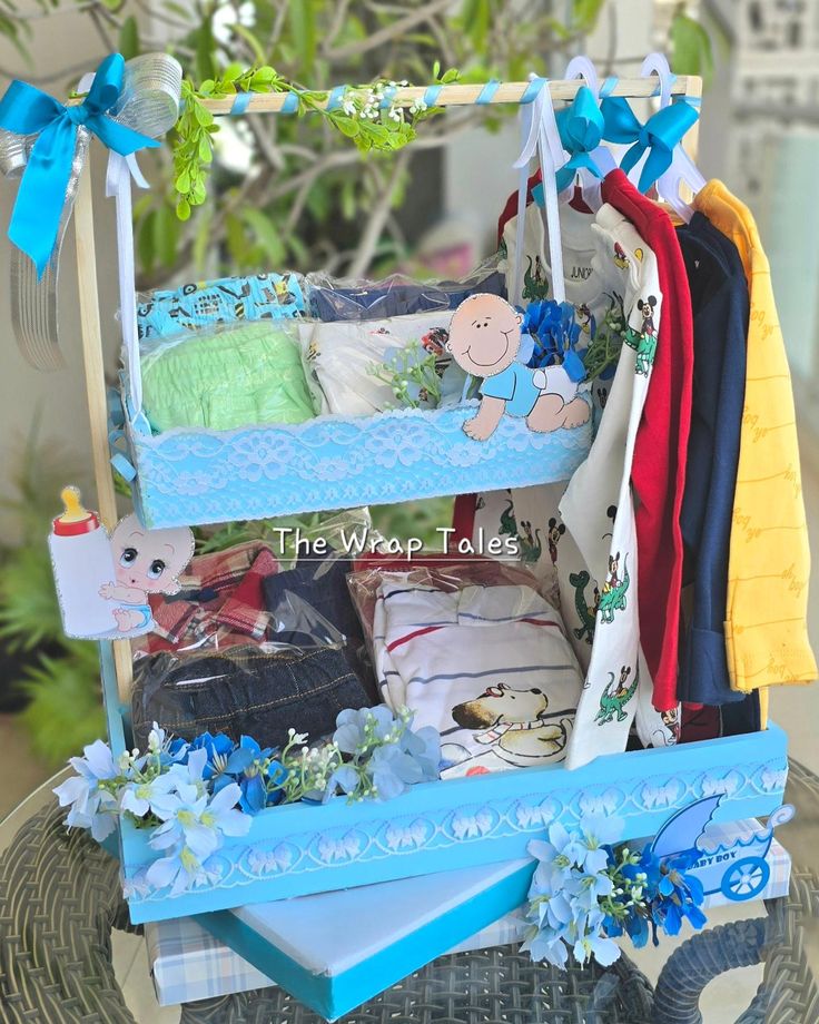 a baby's crib is filled with clothes and other things to put in it