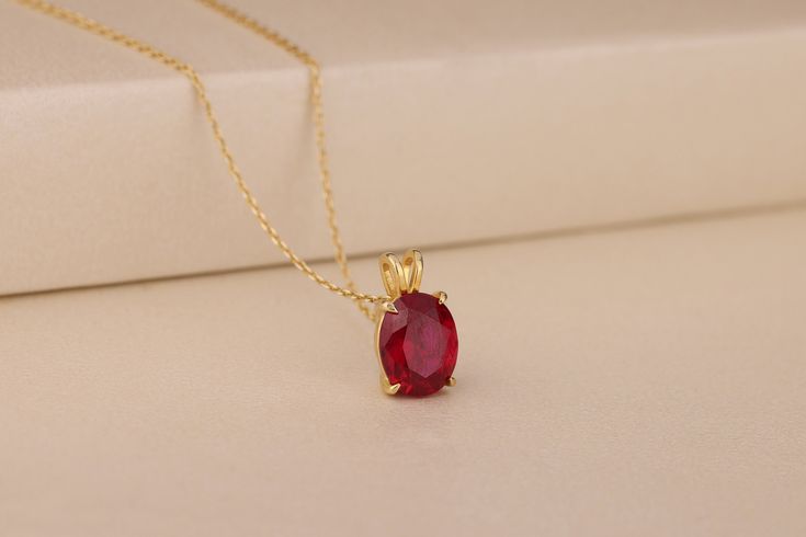 Designed and made with the highest level of craftsmanship, this beautiful 10K and 18K solid gold or 925 silver necklace is just right for you if you love to keep things simple. With a delicate red stone that is perfectly faceted, it would make an excellent gift for anyone who loves minimalistic accessories and wants something different from the ordinary. Details of the product Material: 10K and 14K Solid Gold, Silver Gemstone: Ruby Gemstone Gemstone Size: 8x10 mm Unique Gift For people whom you love; Mom, Girlfriend, Wife, Fiance, Best Friend; Dainty Gift Idea; Valentine's Day Gift, Birthday Gift, Anniversary Gift, Gift For Engagement or Wedding, Promise Gift, Christmas Gift, Black Friday Gift, Mother's Day Gift, International Women's Day Gift, Memorial Gift. By gifting this elegant produc Classic Ruby Necklace With Diamond Cut, Elegant Red Diamond Cut Necklaces, Elegant Red Diamond-cut Necklace, Elegant Red Diamond Cut Necklace, Elegant Yellow Gold Ruby Necklace, Red Diamond-cut Necklace In Fine Jewelry Style, Elegant Gold Necklace With Ruby, Classic Ruby Necklace With Prong Setting, Classic Ruby Necklace In Yellow Gold