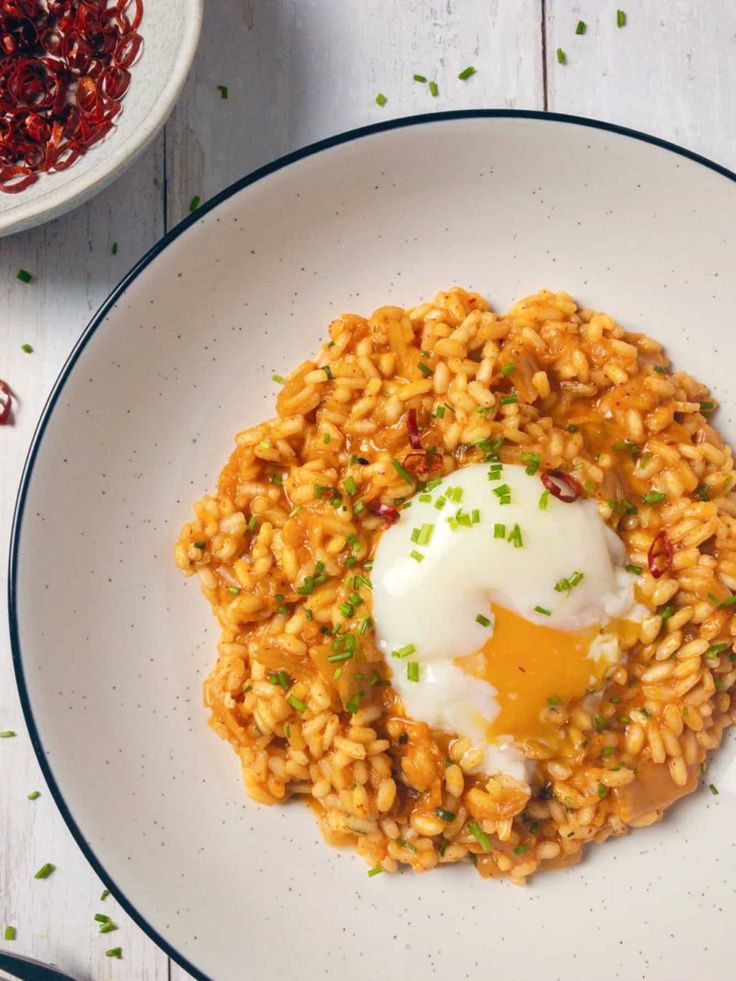 a white plate topped with rice and an egg