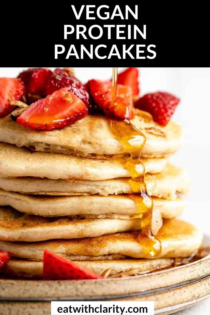 stack of fluffy vegan pancakes with syrup and strawberries on the side text reads, eat with clarify