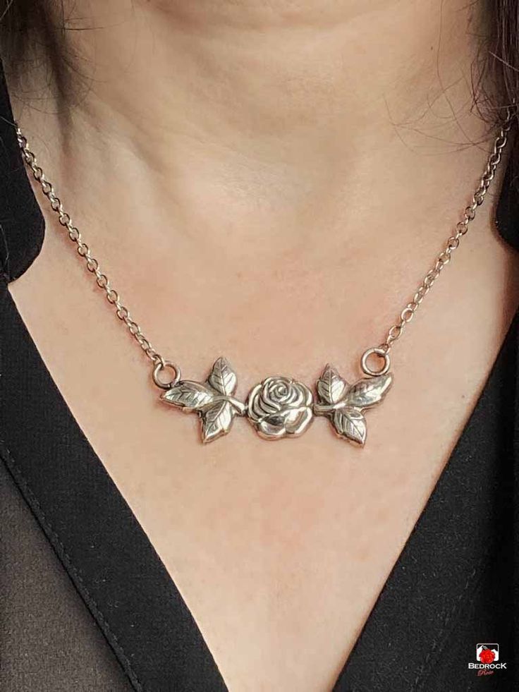 Satisfy your passion for roses with this elegant silver pendant, featuring a solid rose design. The necklace has a diameter of approximately 2" and a height of just under 3/4". Sterling Silver Necklace With Rose Design In Rose Color, Silver Metal Necklace With Rose Design, Elegant Rose Sterling Silver Necklace, Elegant Rose Flower Pendant Necklace, Sterling Silver Rose Necklace With Rose Design, Rose Pendant, Rose Jewelry, Love Rose, Rose Design