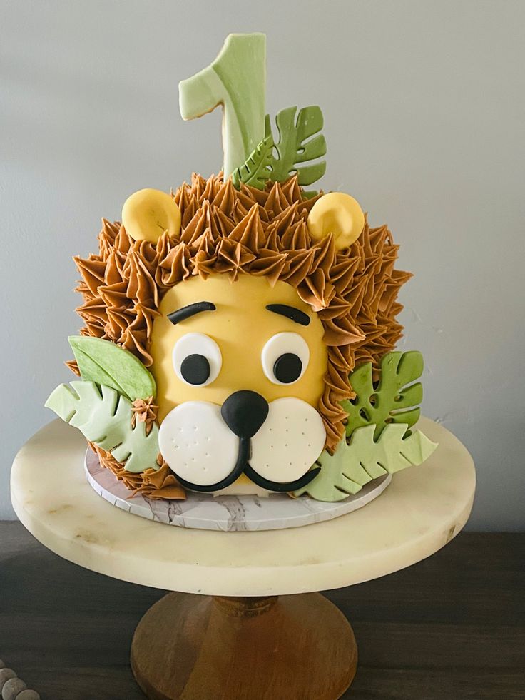 a cake with a lion face on top of it