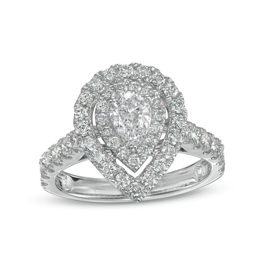 Tell her how much she means to you with this thrilling diamond engagement ring. Crafted in 14K white gold, this design showcases a 1/2 ct. pear-shaped diamond sparkling in a double diamond-lined frame. The shank glistens with diamonds to complete her look. Radiant with 1-1/2 cts. t.w. of diamonds and a bright polished shine, this engagement ring suits her glamorous style. Pear Shaped White Gold Diamond Ring Vvs Clarity, Pear-shaped White Gold Diamond Ring, Dazzling Pear-shaped Diamond Promise Ring, Platinum Diamond Ring With Pear-shaped Accents, White Pear-shaped Diamond Ring With Prong Setting, White Pear Shaped Diamond Ring With Diamond Cut, White Pear-shaped Diamond Ring With Diamond Cut, Teardrop White Gold Diamond Ring With Center Stone, White Gold Teardrop Diamond Ring With Center Stone