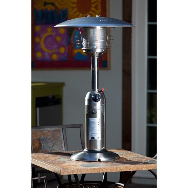 an electric patio heater sitting on top of a wooden table