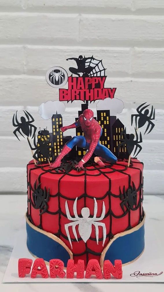 a spiderman birthday cake with the name happy birthday on it