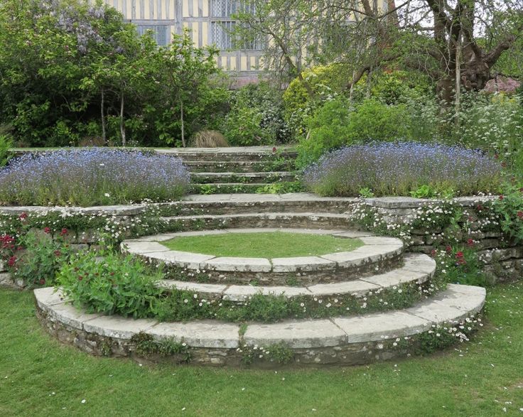 a circular garden with steps leading up to it