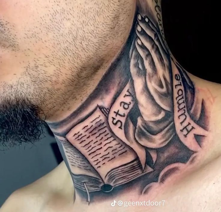 a man wearing a neck tattoo with an open book and praying hands on his chest