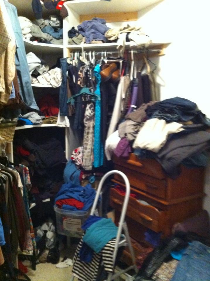 a closet filled with clothes and other items