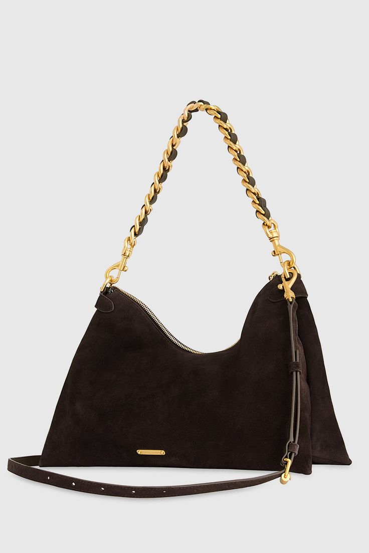 Timeless and versatile, the Stevie Shoulder bag comes with two detachable straps. Wear it as a shoulder bag with the chain strap, or a crossbody bag with the longer suede strap, or remove them both and use it as a clutch. The possibilities are endless! Style# HF24TSUDNQ 100% Suede Leather Antique Brass Hardware 15" W X 10. 5" H X 4. 5" D Detachable strap - 21" Zip closure One interior zip pocket Imported The photos featuring a model are for size reference only. Actual color and material may vary Leather Outerwear, Antique Brass Hardware, Large Shoulder Bags, Leather Dresses, Brass Hardware, Handbag Accessories, Chain Strap, Belt Bag, Shoe Collection