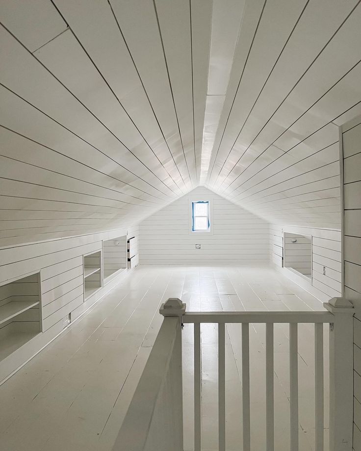 an empty room with white walls and wooden floors is seen in this image from the inside