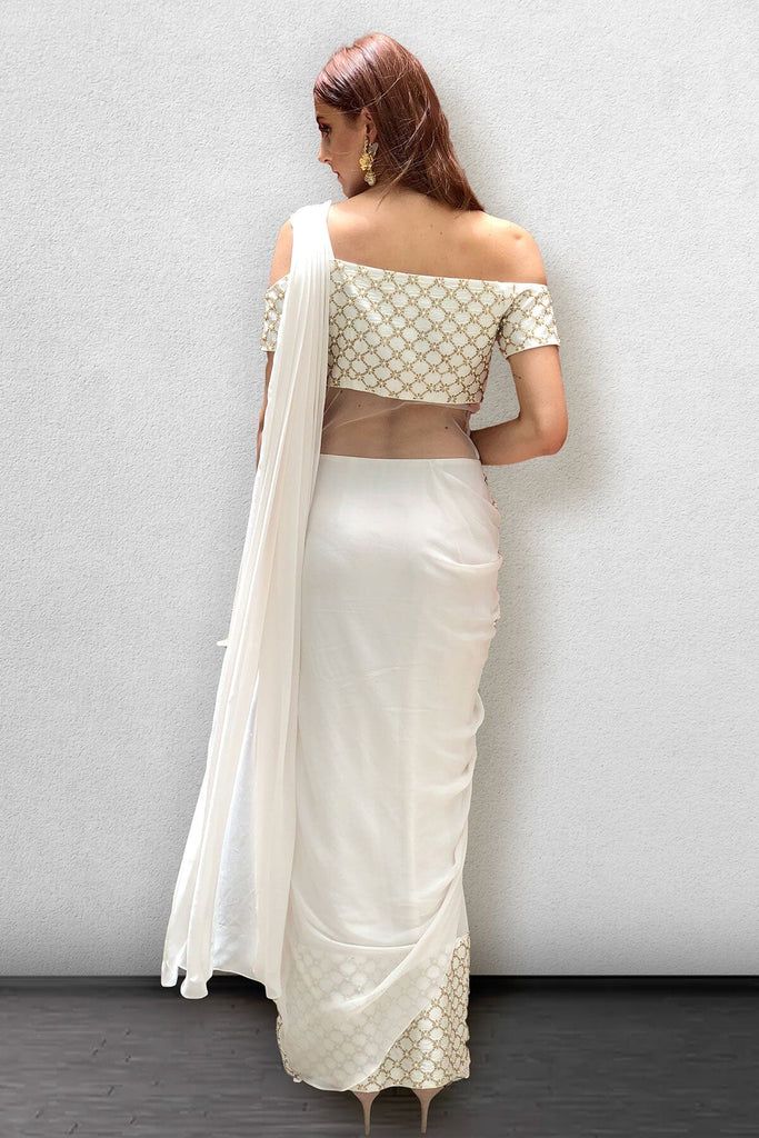 White Georgette Pre-draped Saree With Pearl Embroidery, Elegant White Blouse With Traditional Drape, White Georgette Blouse For Reception, White Traditional Drape Blouse For Reception, Elegant White Pre-draped Saree With Pearl Embroidery, Elegant White Pearl Embroidered Pre-draped Saree, White Blouse With Traditional Drape For Parties, White Embellished Blouse With Traditional Drape, Embellished White Blouse In Traditional Drape