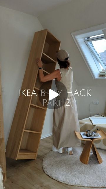 a woman standing on top of a wooden ladder